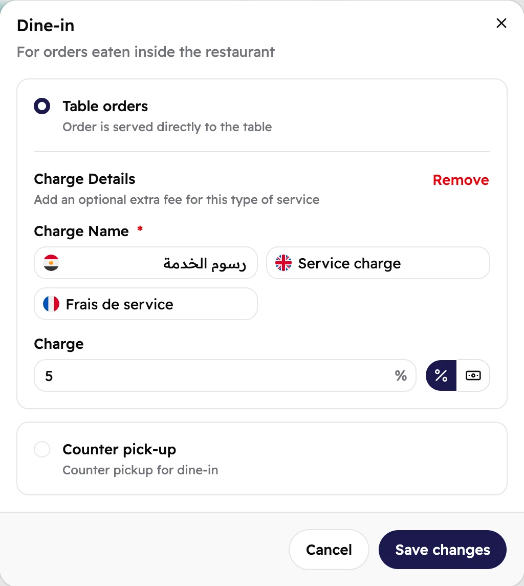 The Dine-in window: Table orders picked, with a 5% service charge named in Arabic, English and French.